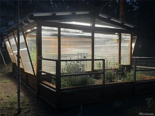 a living room with couch next to a window