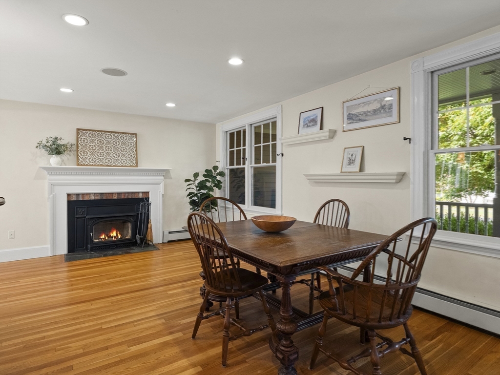 22 Bryant Road Lexington, MA 02420 - Photo 12 of 40 a view of a dining room with furniture and a fireplace