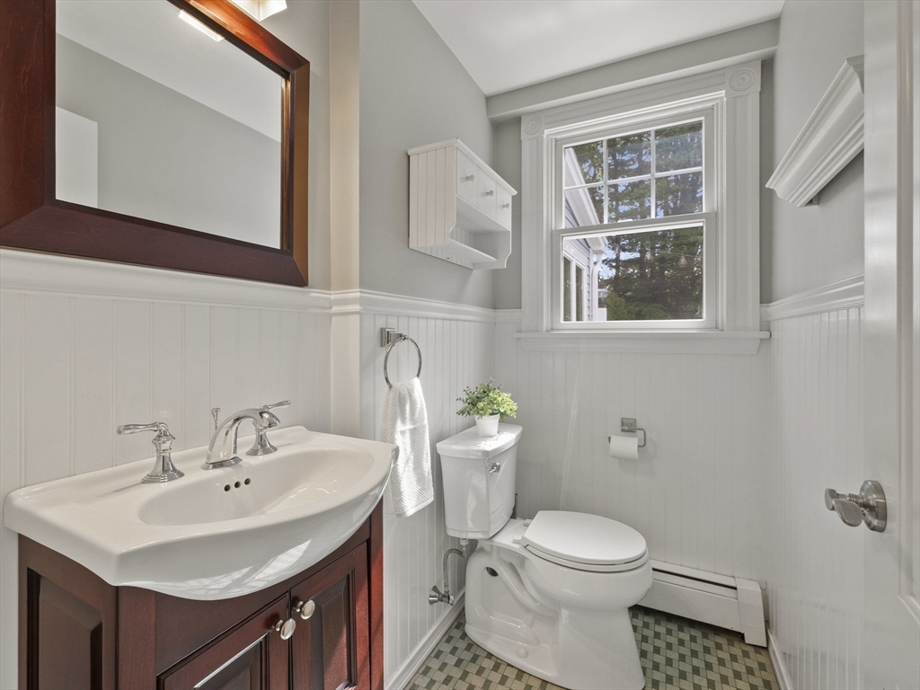 22 Bryant Road Lexington, MA 02420 - Photo 14 of 40 a bathroom with a sink toilet and a mirror