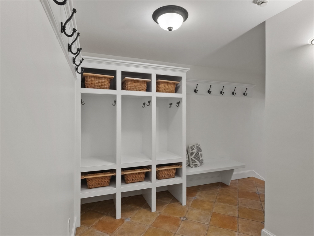 22 Bryant Road Lexington, MA 02420 - Photo 16 of 40 a view of an empty room with a cabinet and wooden floor