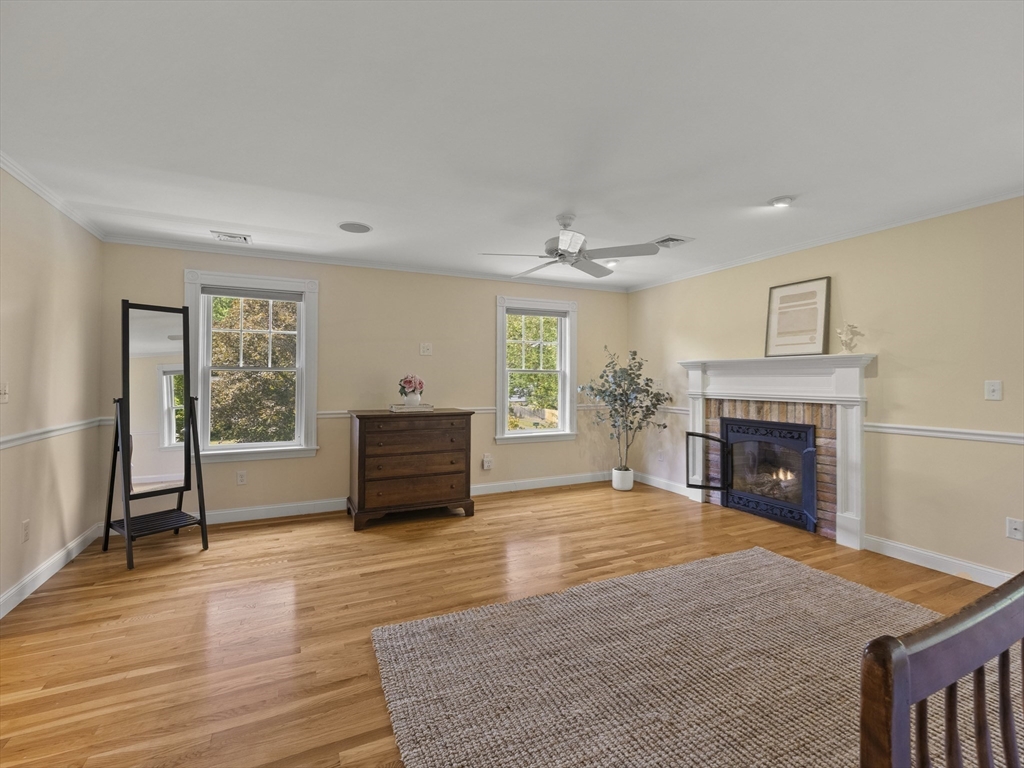 22 Bryant Road Lexington, MA 02420 - Photo 18 of 40 a view of a livingroom with a fireplace window and wooden floor