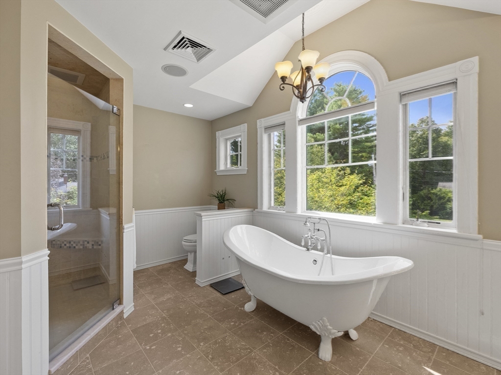 22 Bryant Road Lexington, MA 02420 - Photo 19 of 40 a spacious bathroom with a bathtub and shower
