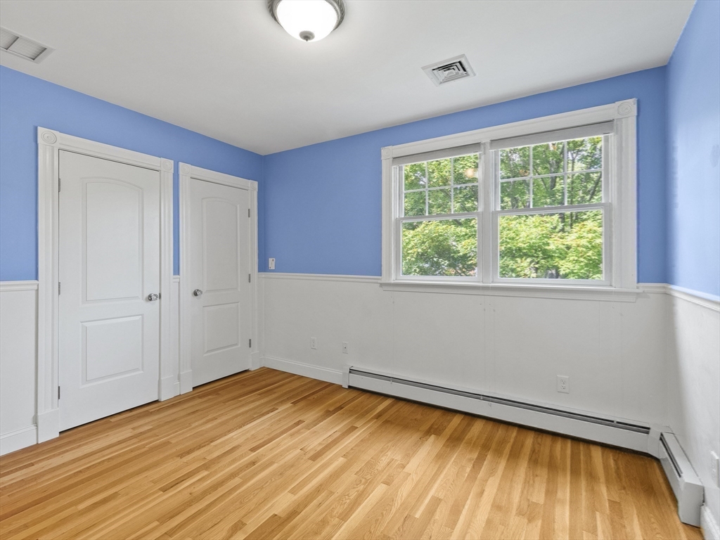 22 Bryant Road Lexington, MA 02420 - Photo 25 of 40 a view of empty room with wooden floor and fan