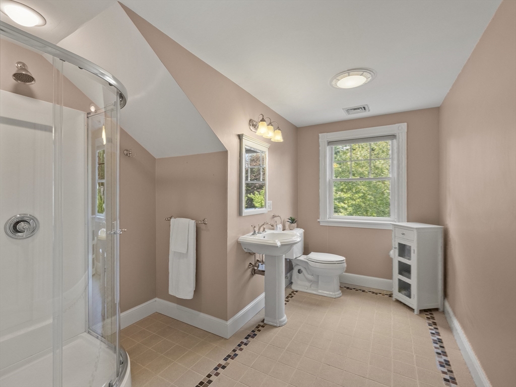 22 Bryant Road Lexington, MA 02420 - Photo 28 of 40 a bathroom with a toilet sink and tub