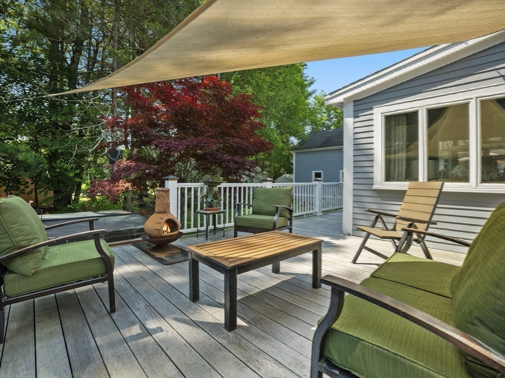 22 Bryant Road Lexington, MA 02420 - Photo 34 of 40 a outdoor sitting area with furniture and wooden floor