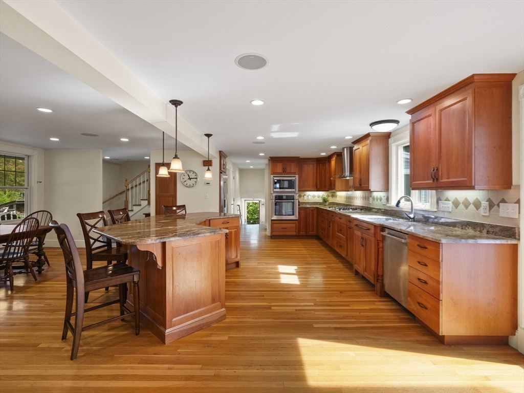 22 Bryant Road Lexington, MA 02420 - Photo 9 of 40 a large kitchen with lots of counter space and stainless steel appliances