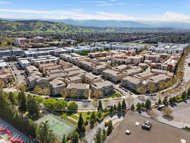 front view of a brick house with a yard