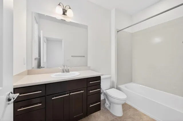 a living room with lots of furniture and a large window