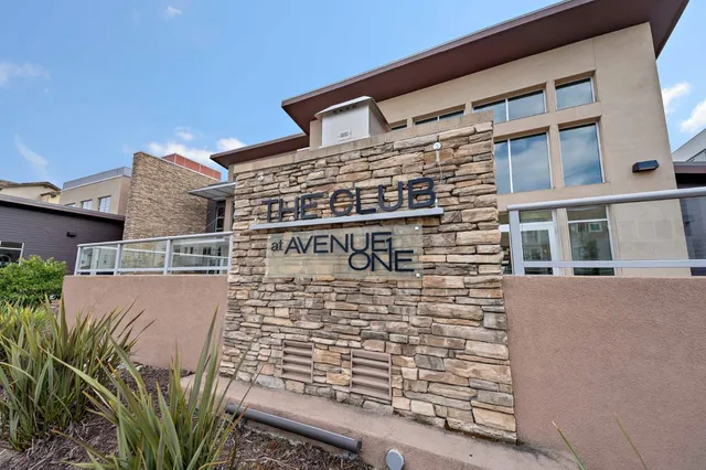 a view of a building with sitting area