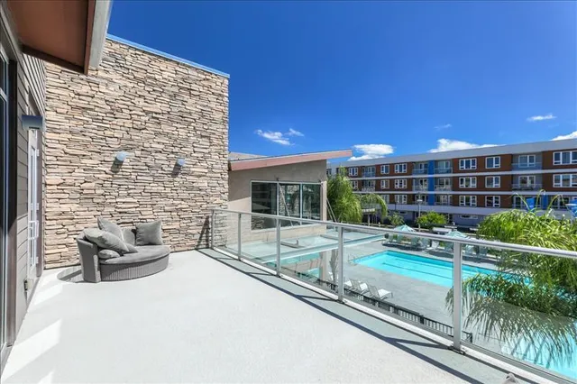 a view of a swimming pool with a patio