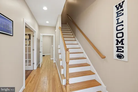 a view of a staircase and wooden floor
