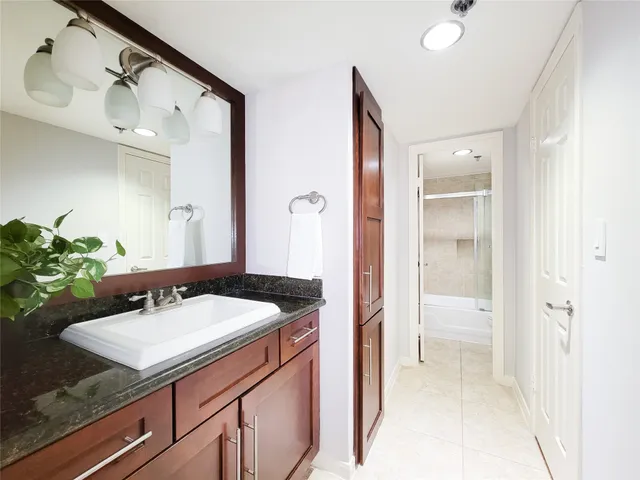 a bathroom with a sink and a mirror