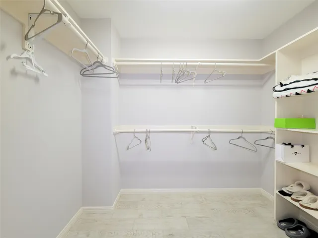 a bedroom with bed and window