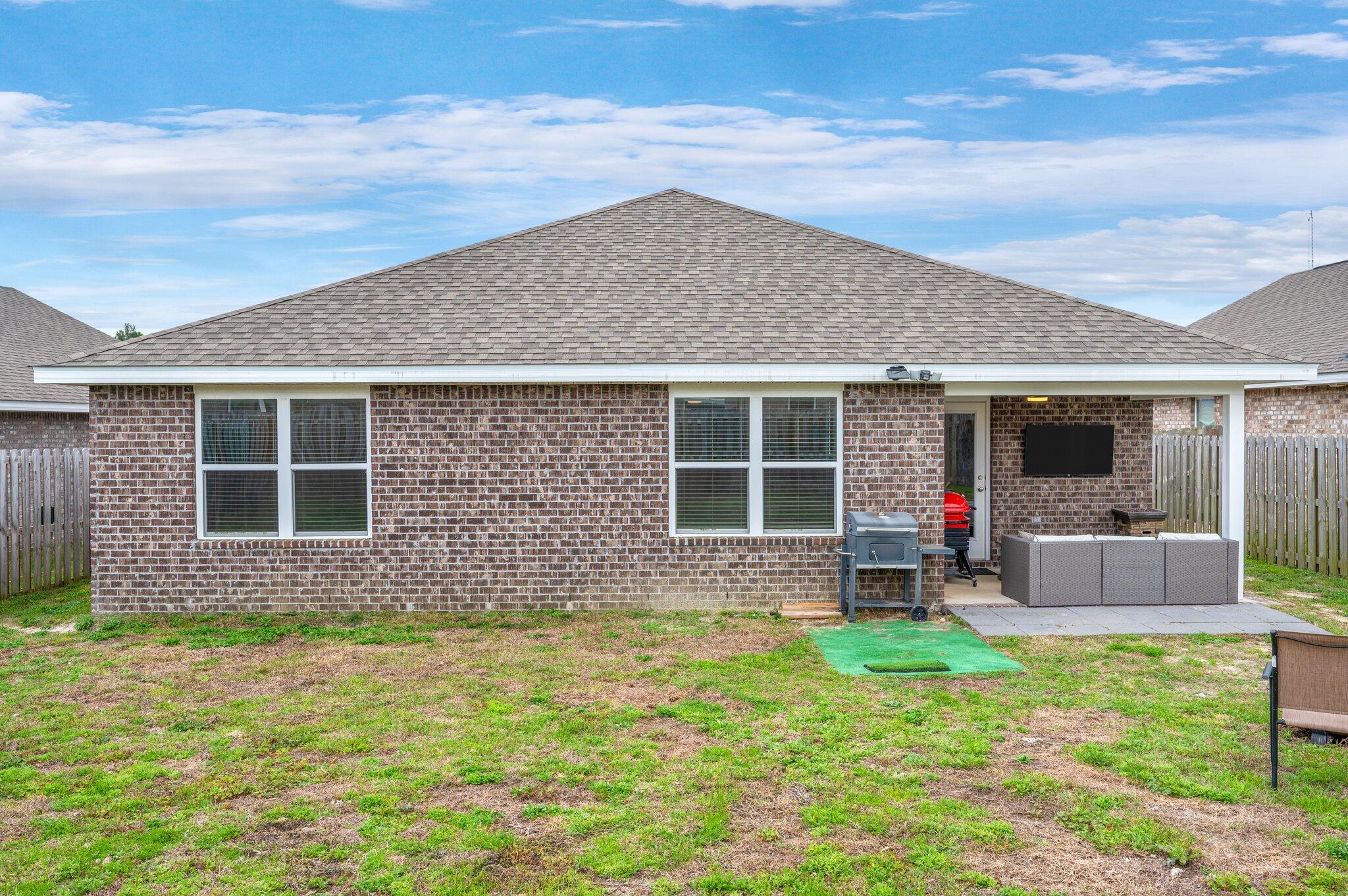 1018 Limpkin Street Crestview, FL 32539 - Photo 29 of 34 Large back Yard with covered patio