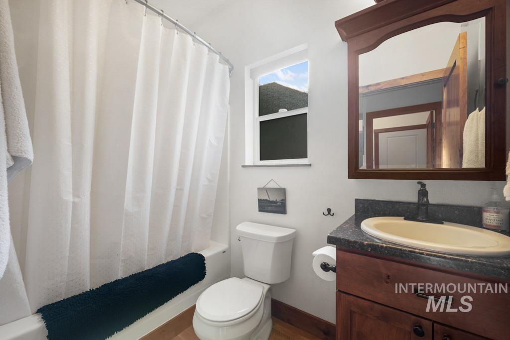 417 East E Street Moscow, ID 83843 - Photo 12 of 29 Full bath with vanity and shower / bathtub combination with curtain