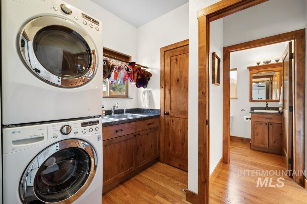 417 East E Street Moscow, ID 83843 - Photo 13 of 29 Laundry area featuring light wood finished floors and stacked washer / drying machine