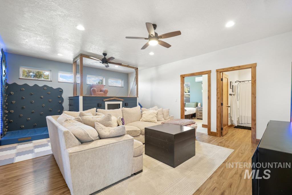 417 East E Street Moscow, ID 83843 - Photo 21 of 29 Living room with wood finished floors, ceiling fan, and recessed lighting