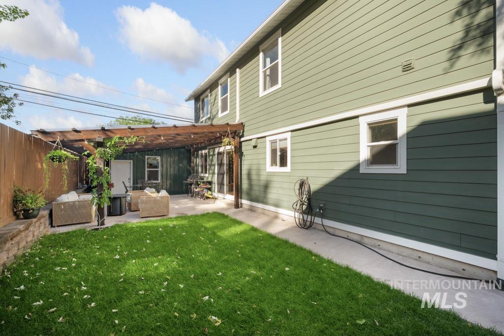 417 East E Street Moscow, ID 83843 - Photo 25 of 29 Back of house with a pergola, a patio, and an outdoor hangout area