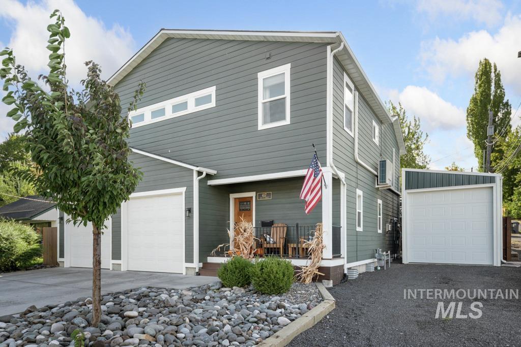 417 East E Street Moscow, ID 83843 - Photo 3 of 29 View of front of home featuring a garage, driveway, and a porch