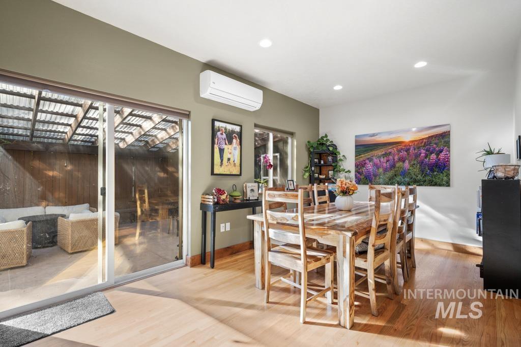 417 East E Street Moscow, ID 83843 - Photo 8 of 29 Dining space featuring light wood finished floors, a wall mounted air conditioner, and recessed lighting