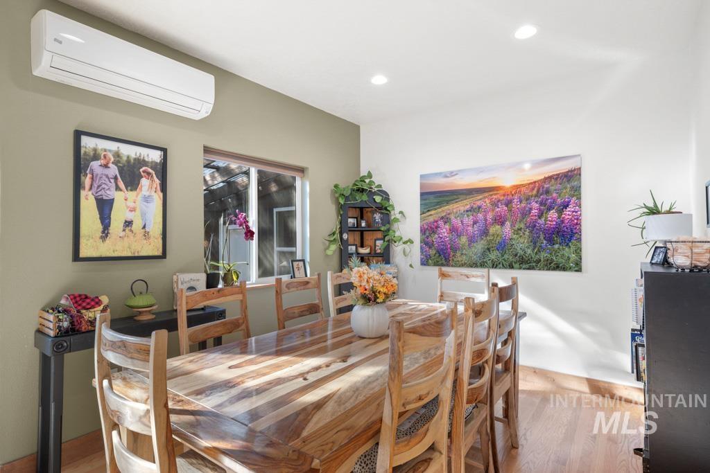 417 East E Street Moscow, ID 83843 - Photo 9 of 29 Dining area featuring a wall mounted air conditioner, light wood finished floors, and recessed lighting
