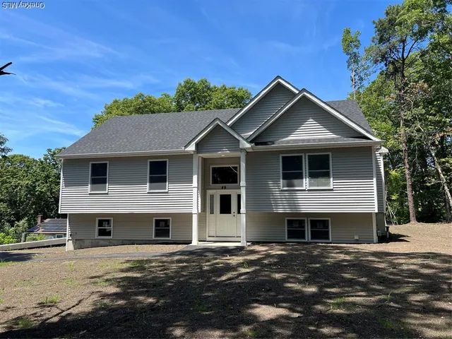a front view of a house with a garage