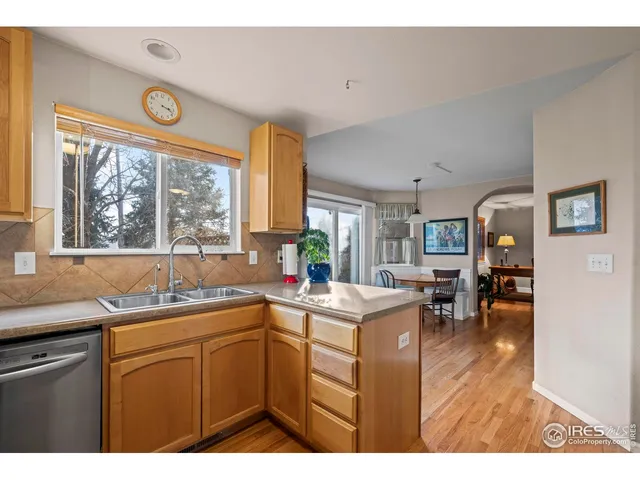 a kitchen that has a sink and a stove in it
