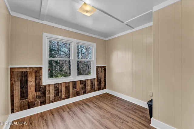 a view of wooden floor and windows in a room
