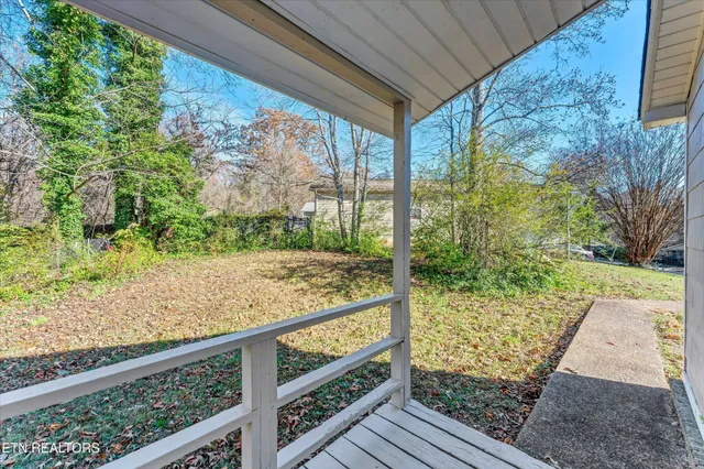 a view of balcony with yard