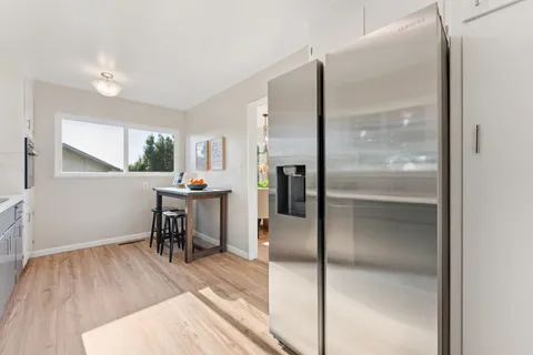 a bedroom with a bed and a desk in it