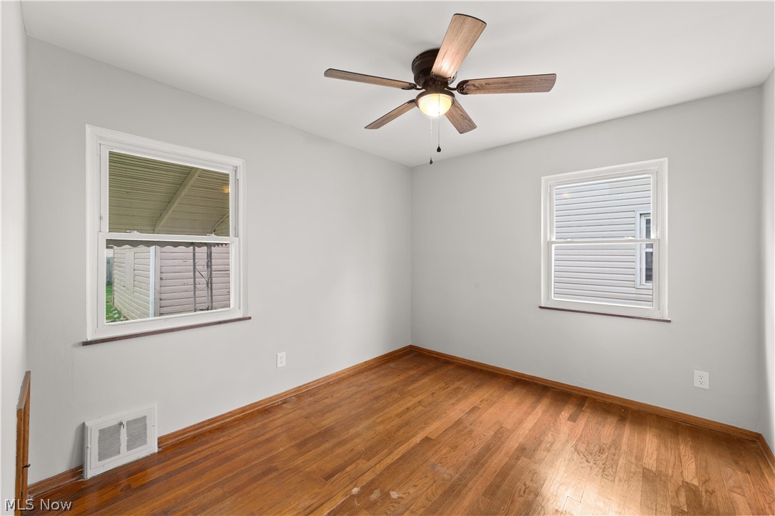 4907 Ridge Road Cleveland, OH 44144 - Photo 21 of 36 Unfurnished room featuring ceiling fan and hardwood / wood-style floors