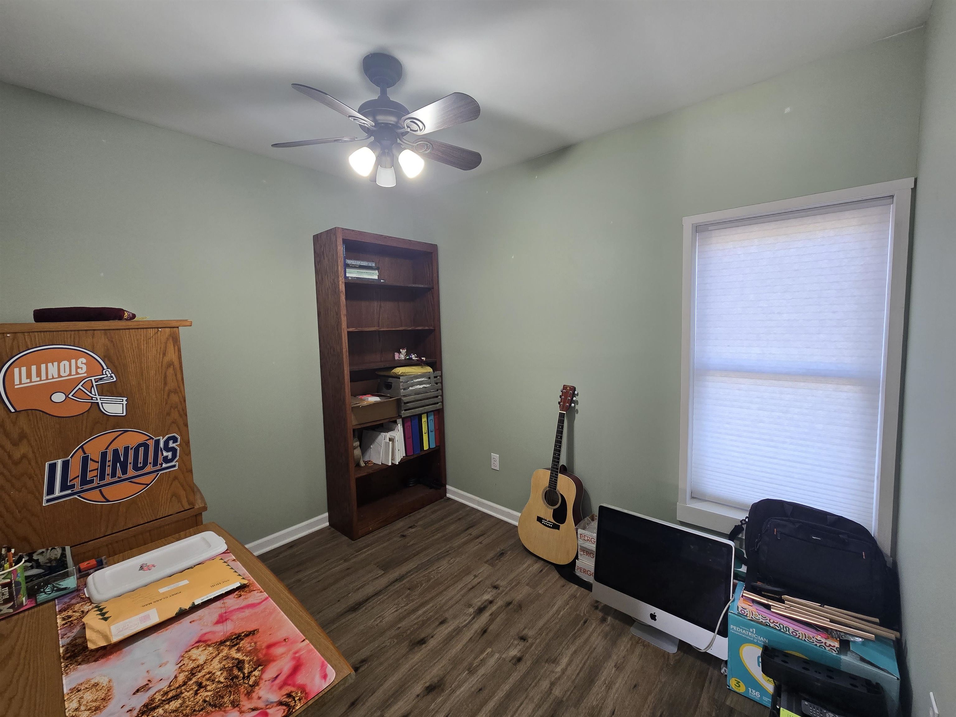 732 West 2nd Street Byron, IL 61010 - Photo 14 of 22 a workspace with furniture and wooden floor