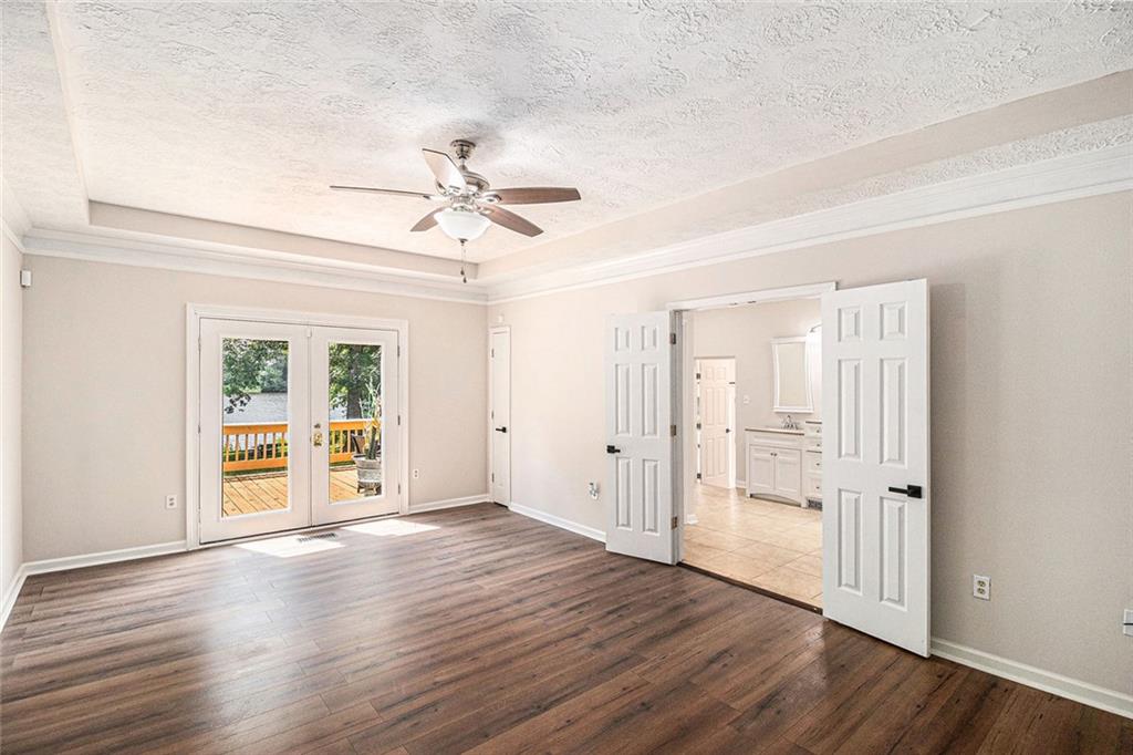 96 Pointe View Court Jackson, GA 30233 - Photo 11 of 36 a view of an empty room with window and wooden floor
