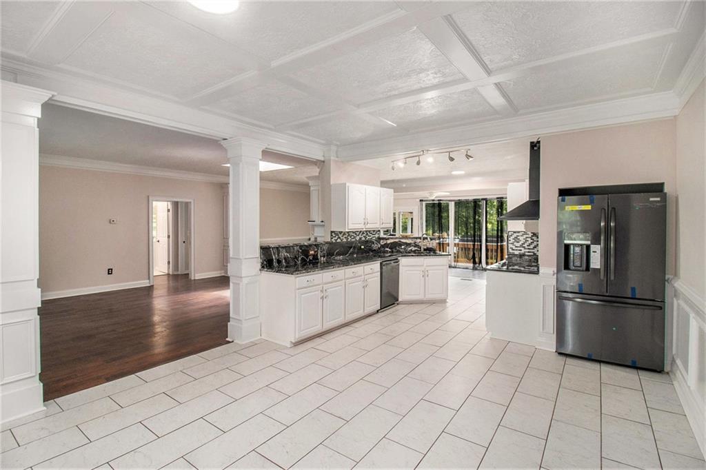 96 Pointe View Court Jackson, GA 30233 - Photo 14 of 36 a kitchen with stainless steel appliances kitchen island granite countertop a refrigerator and a stove top oven