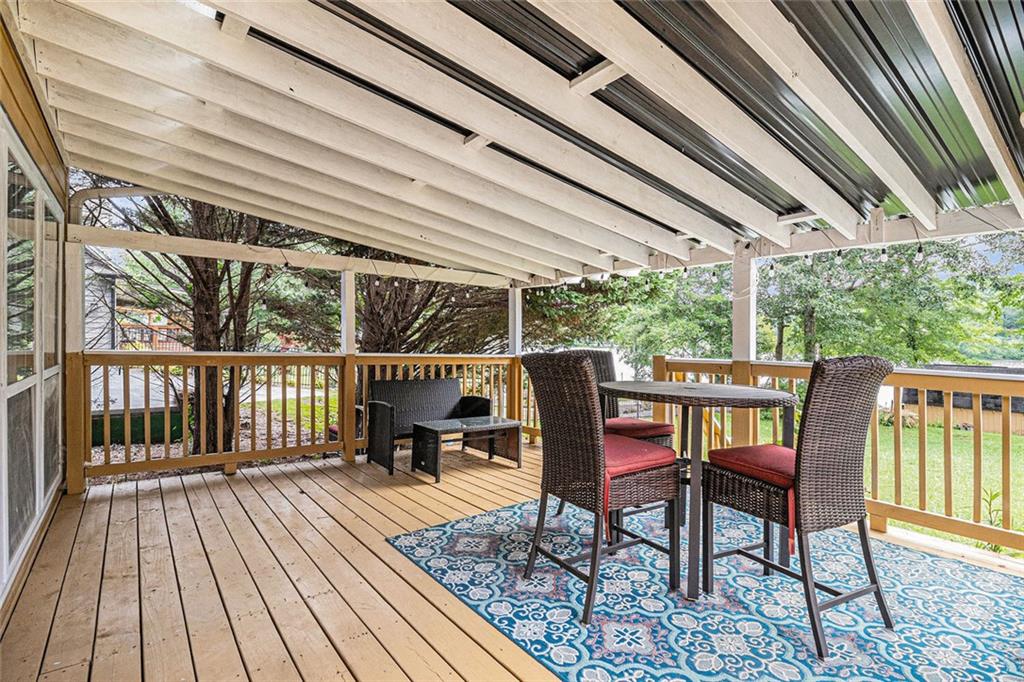 96 Pointe View Court Jackson, GA 30233 - Photo 16 of 36 a view of a chairs and table in the balcony