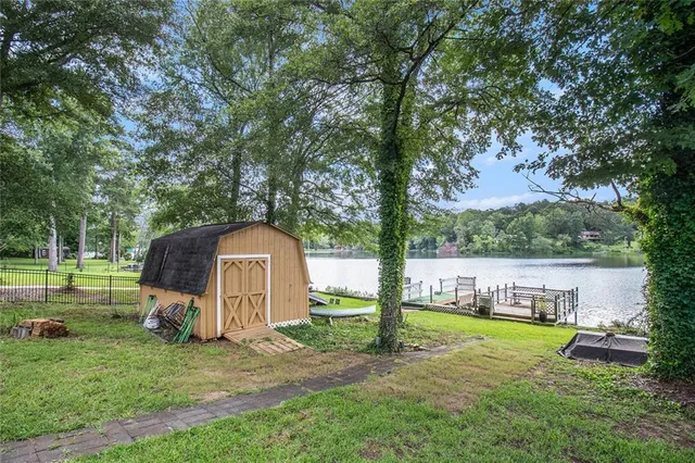 a view of a garden with a house in the background