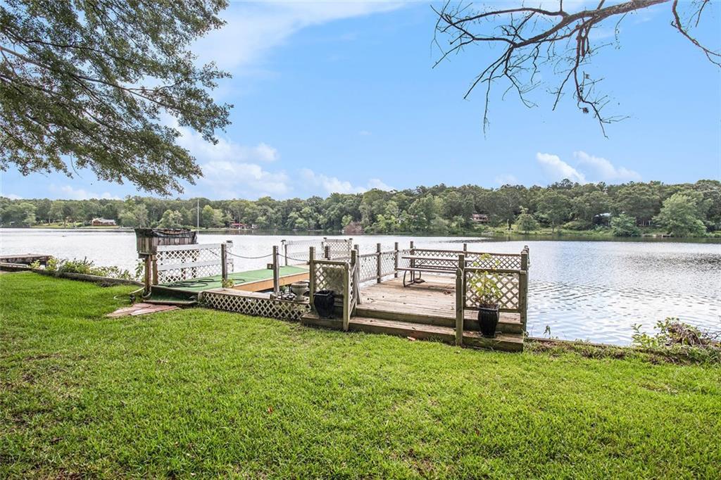 96 Pointe View Court Jackson, GA 30233 - Photo 31 of 36 a view of a lake with houses in the back