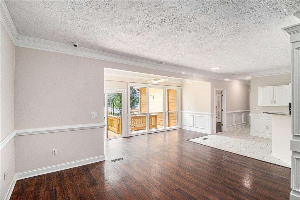 96 Pointe View Court Jackson, GA 30233 - Photo 5 of 36 a view of an empty room with wooden floor and a window