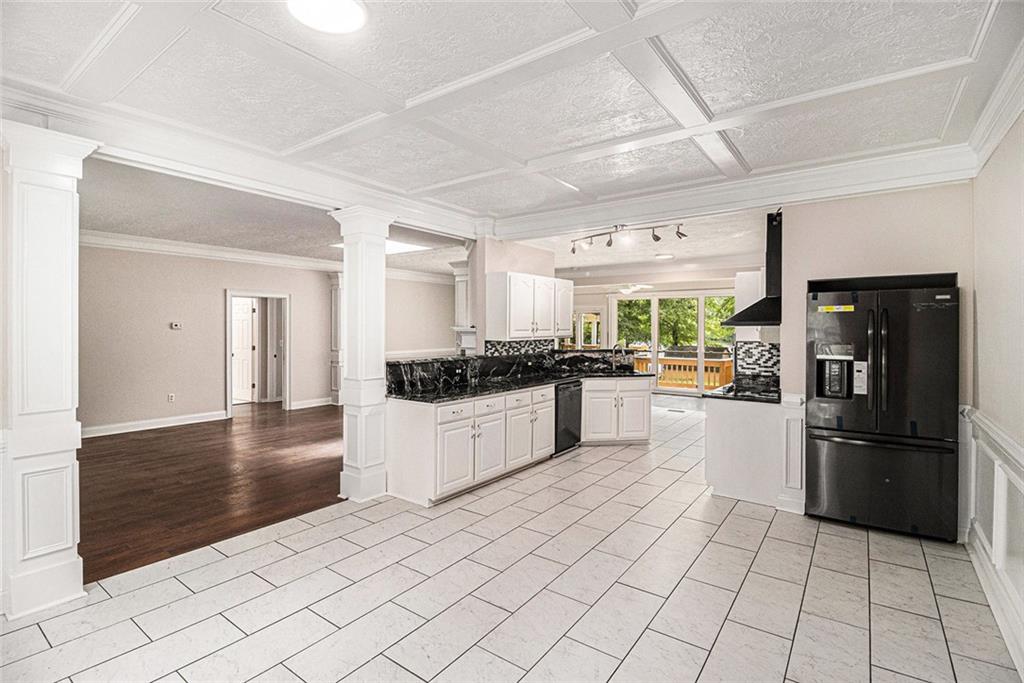 96 Pointe View Court Jackson, GA 30233 - Photo 6 of 36 a kitchen with stainless steel appliances kitchen island granite countertop a refrigerator and a sink
