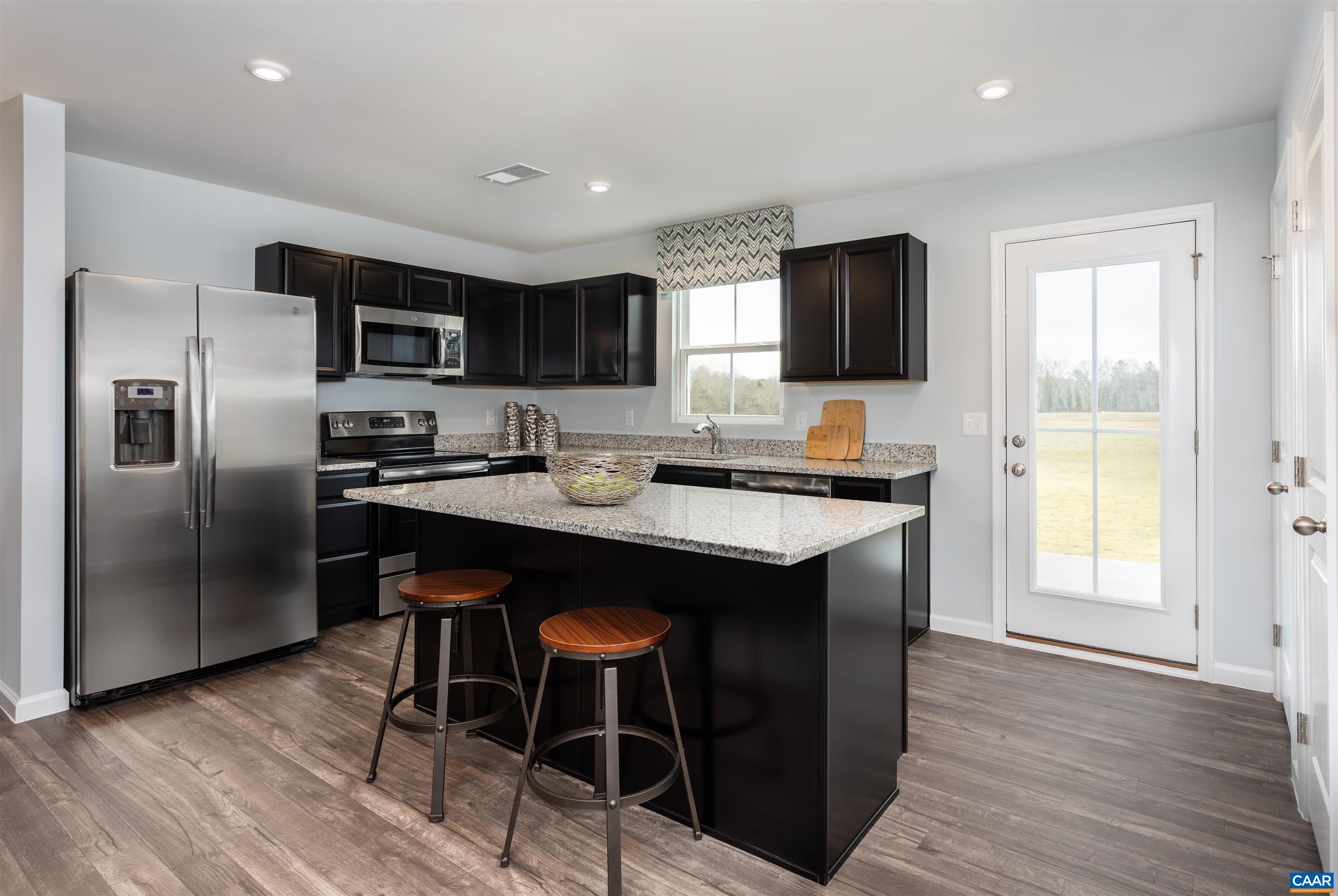 163 Arches Lane Barboursville, VA 22923 - Photo 2 of 12 a kitchen with stainless steel appliances granite countertop a sink a stove a microwave a refrigerator and island