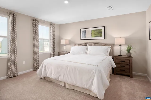 a bedroom with a bed and a night stand