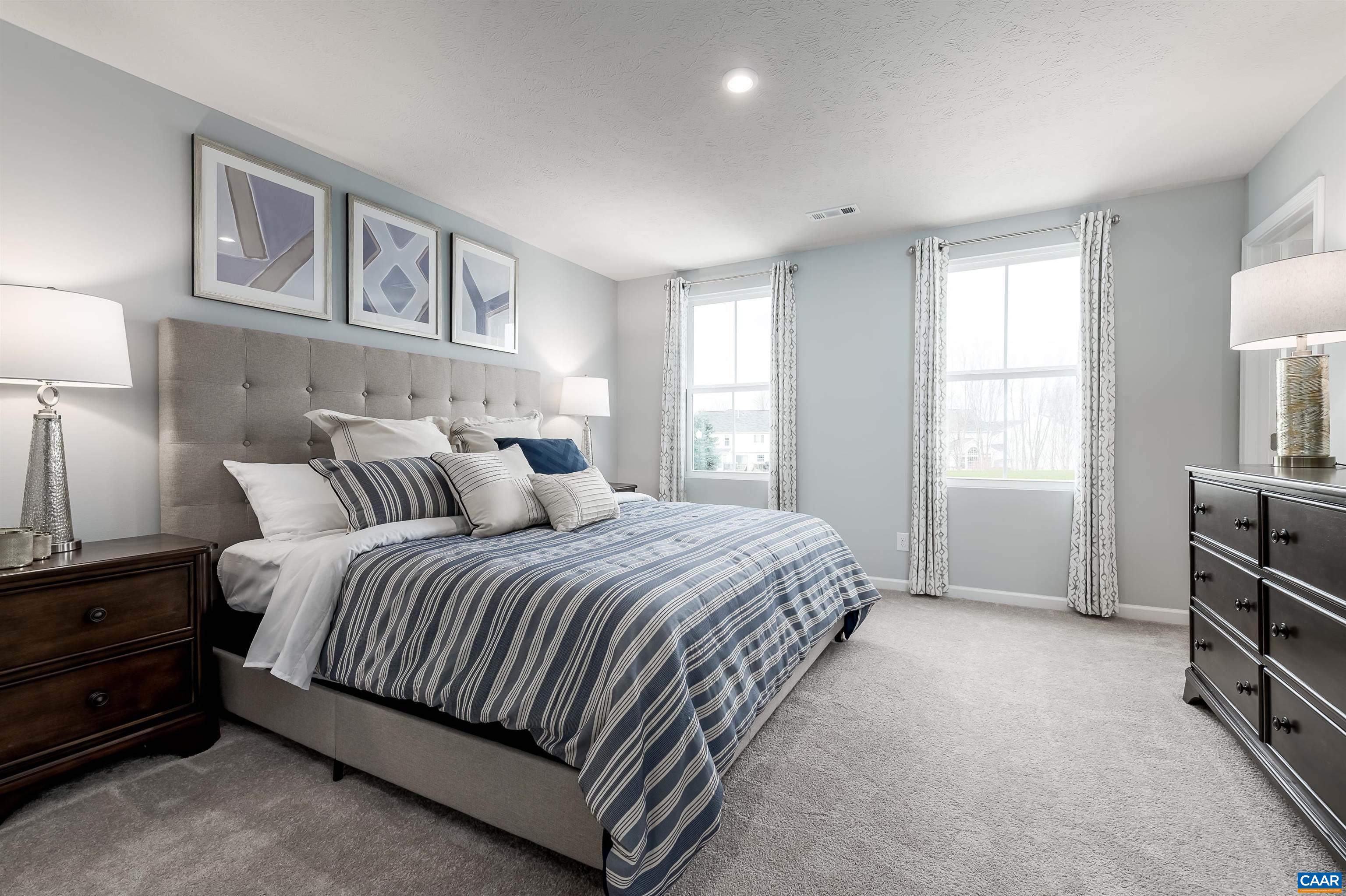 163 Arches Lane Barboursville, VA 22923 - Photo 6 of 12 a spacious bedroom with a bed and a cabinets