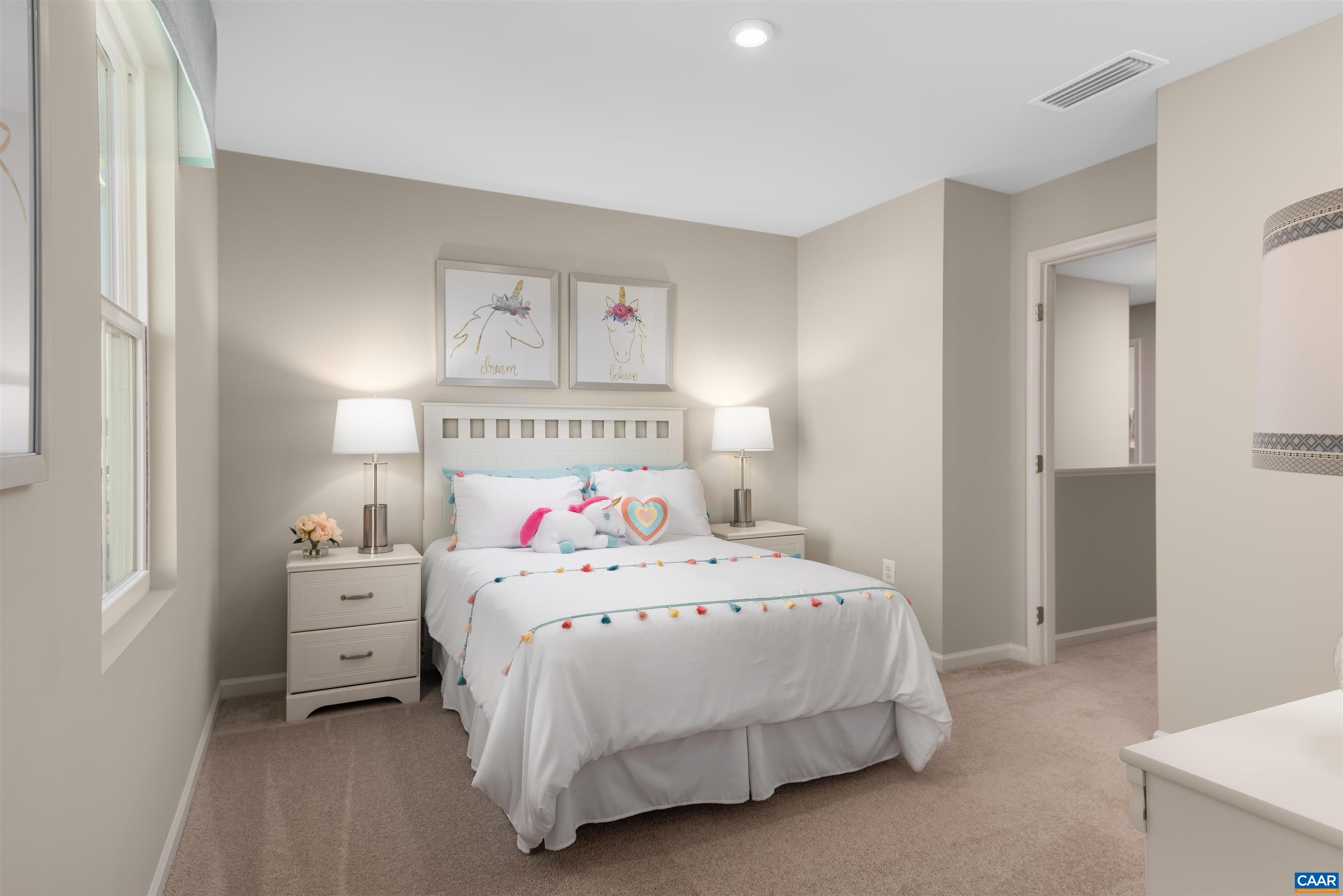 163 Arches Lane Barboursville, VA 22923 - Photo 8 of 12 a bedroom with a bed and a chandelier