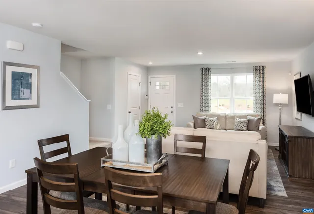 a view of a dining room with furniture and window