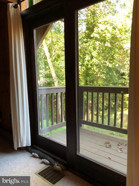 2841 Allspice Road Port Republic, MD 20676 - Photo 7 of 14 Master bedroom balcony with slight view of the bay