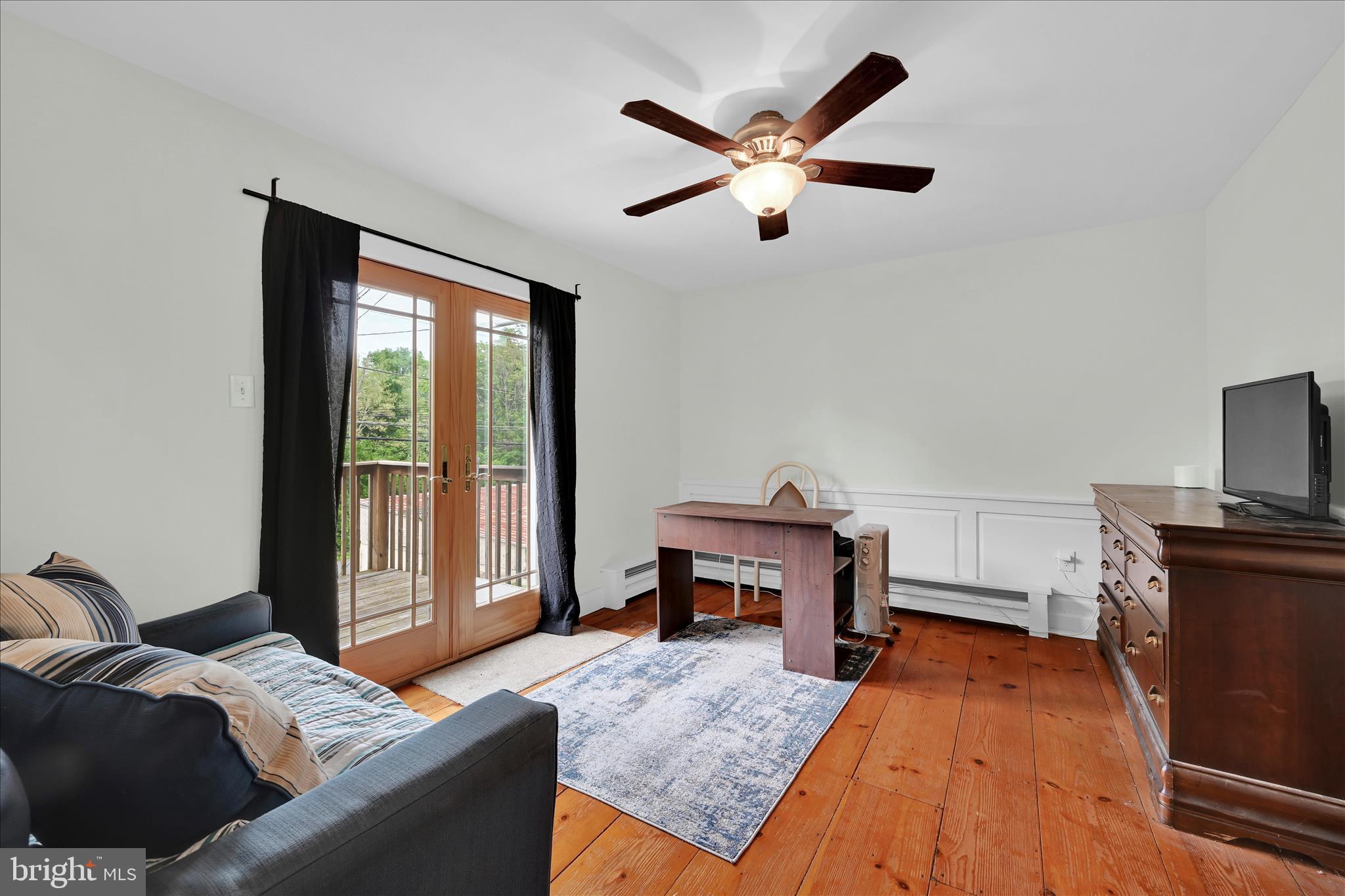286 Schuylkill Road Birdsboro, PA 19508 - Photo 9 of 39 a bedroom with a bed and wooden floor
