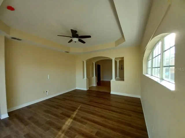 a view of an empty room with a window