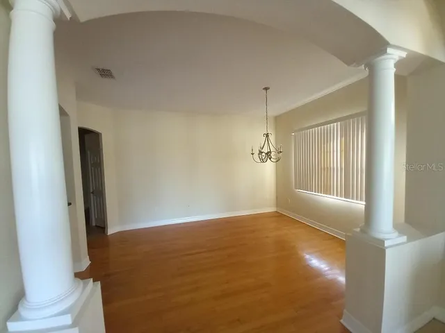 a view of an empty room and window