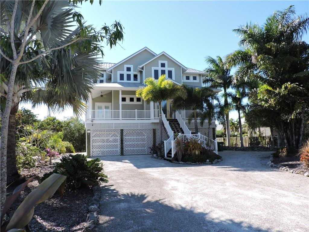 111 Kettle Harbor Drive Boca Grande, FL 33921 - Photo 1 of 1 a front view of a house with a yard and garage