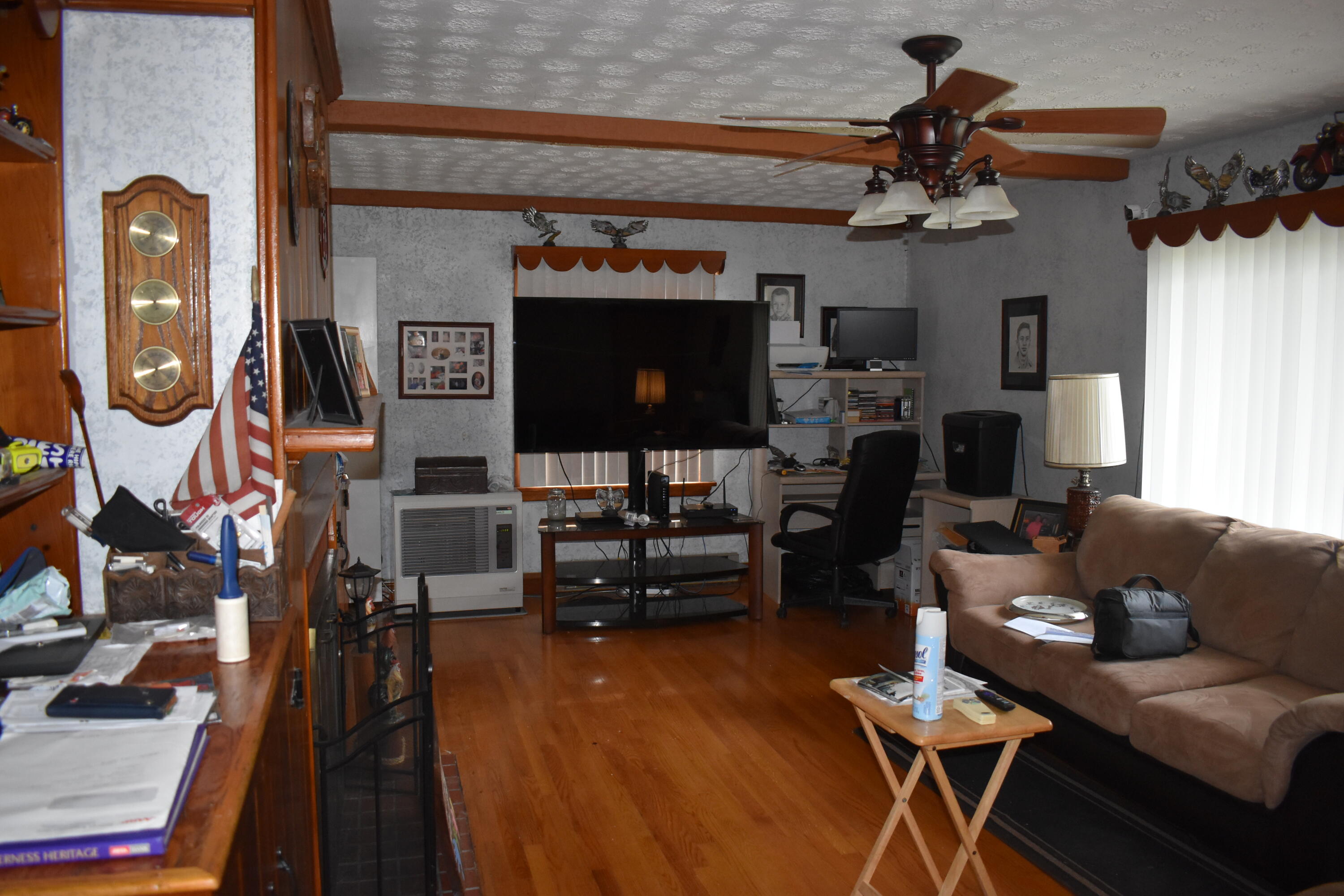 4904 Newbern Road Pulaski, VA 24301 - Photo 22 of 51 a living room with furniture and a fireplace